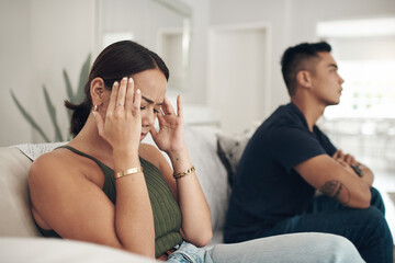 Frustrated couple, argument and fight with headache on sofa for breakup, conflict or disagreement...