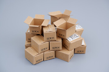 Shipping carton boxes heap on gray background. 