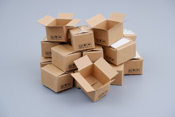 Shipping carton boxes on gray background. Packing and delivery concept.