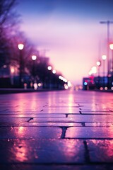 A blurry photo of a city street at night with a pinkish hue