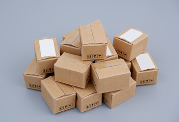 Many shipping carton boxes on gray background. 