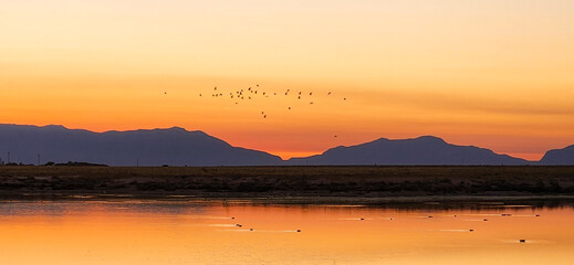 A scenic sunset view of Holloman Lake in New Mexico.