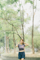 Beautiful Sport woman in sportswear running in the park. Healthy lifestyle and sport concept.