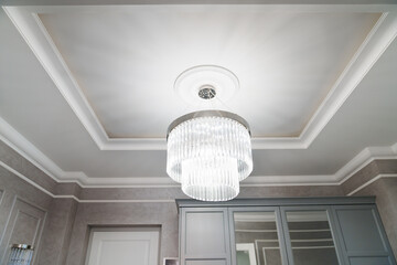 Beautiful ceiling lamp with glass pendants in classic style. 