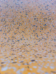 Smooth surface, yellow stone pattern.