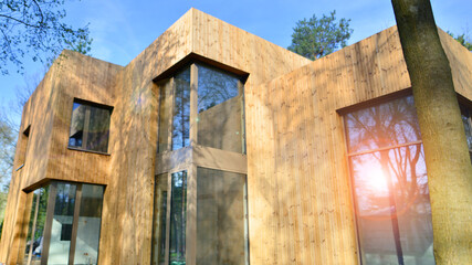Fototapeta na wymiar New single family house. Residential home with modern wooden facade. 