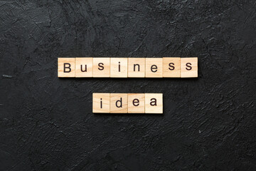 business idea word written on wood block. business idea text on cement table for your desing, concept