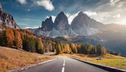 amazing mountain landscape at autumn sunny day scenic alpine scenery of dolomites alps wonderful view on mountain valley forest and asphalt road for majestic rocky peak travel on bike concept - obrazy, fototapety, plakaty