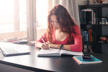 Millennial student sit at desk study on laptop - 781102827