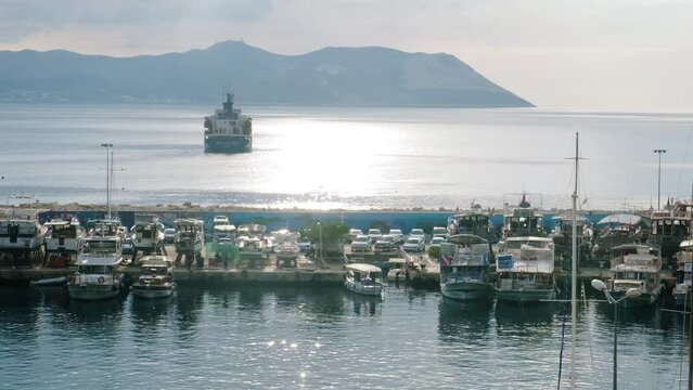 Resort town bay with a mooring yachts, speedboats and boats. Kas, Turkey, 2024