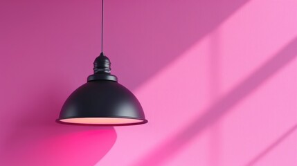 Obraz premium Modern Black Pendant Light on Vibrant Pink Background with Shadows