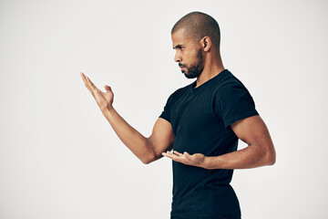 Tai chi, exercise and man in martial arts training or calm movement with hands on white background....