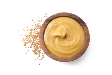 Fresh tasty mustard sauce in bowl and dry seeds isolated on white, top view