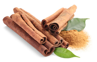 Dry aromatic cinnamon sticks, powder and green leaves isolated on white