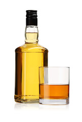 Glass and bottle of whiskey isolated on white