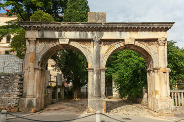 Fototapeta na wymiar Dvojna vrata. Twin gates. Pula, Croatia. The end of 2nd century AD. Roman style.