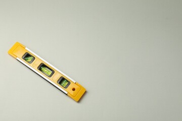 Building level on beige background, top view. Space for text