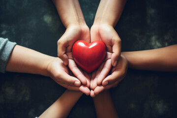 Group of hands holding red heart, health care, love, organ donation, family insurance and CSR concept
