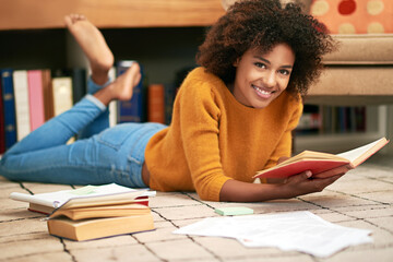 African woman, books and portrait on floor in library for learning, relax and self study for...