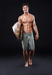 Wood surfboard, portrait and man in studio for water sports, exercise or fitness workout. Shirtless, smile and full body of male surfer athlete with vintage or retro wave board by black background.