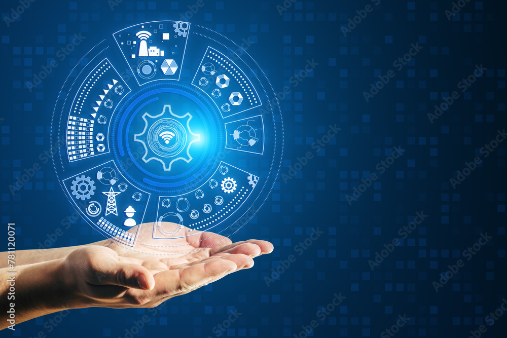 Poster close up of businessman hand holding round digital cogwheel and other icons hologram on blue backgro