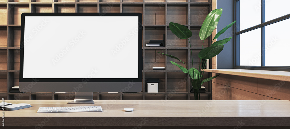 Poster Close up of modern designer office workplace with empty white computer monitor, window with city view and wooden shelves in the background. Mock up, 3D Rendering.