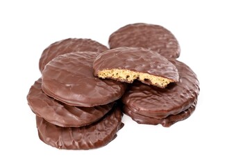 Heap of ginger biscuits covered with chocolate on white background
