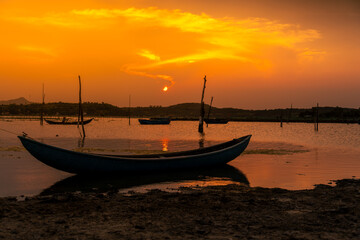 Traditional boats at O Loan lagoon in sunset, Phu Yen province, Vietnam