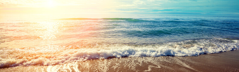 Seascape in the early morning. Sunrise over the sea. Surf line. Horizontal banner