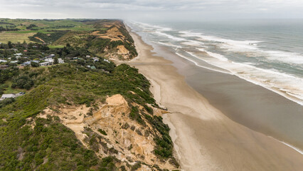 Rugged and beautiful beach, the west coast of New Zealands Northland.  Ripiro beach, holidays, travel and vacation.  Waves and sand.