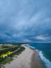 Sunrise Seascape with beautiful cloud covered sky and gentle surf