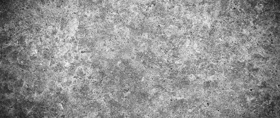 Dirty old distressed grunge concrete texture banner background. Grungy monochrome cement wall...