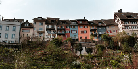 Fototapeta na wymiar Colorfull Houserow with beautiful steep garden