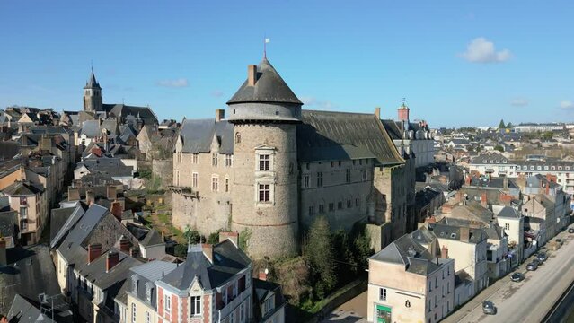 Chateau de Laval castle and riverside, Mayenne in France. Aerial forward ascending