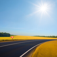 asphalt road turn at summer sunny day