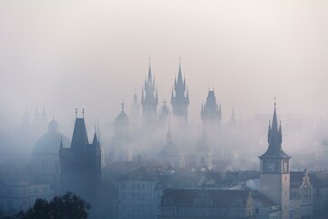 The city streets were cloaked in a ghostly veil as the thick fog shrouded buildings, casting an...