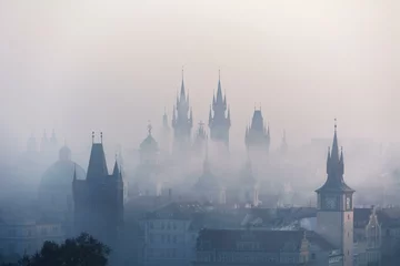 Foto auf Leinwand The city streets were cloaked in a ghostly veil as the thick fog shrouded buildings, casting an eerie ambiance over the urban landscape, muffling sounds and distorting distant lights. © ANGIA