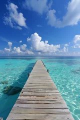 Foto op Plexiglas A pier on crystal clear ocean © grey