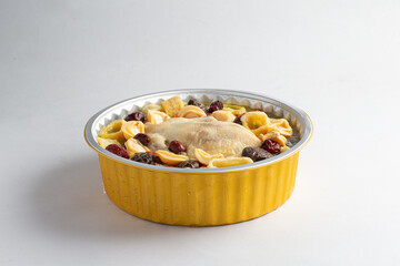 freshly hot stewed whole kampong chicken with abalone seafood in clay pot herbal soup on white table hotel chinese new year banquet restaurant halal food cafe menu