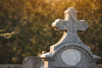 The cemetery's landscape is adorned with weathered tombstones and crosses, each bearing witness to the passage of time and the memories of those laid to rest. - 781141679