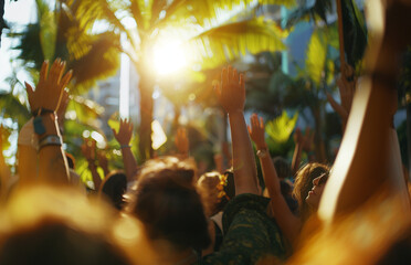 people dancing at a concert with their hands up, view from the back