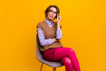 Photo portrait of attractive woman sit chair look unsure point empty space dressed retro office...