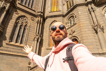 Selfie of a tourist visiting the Church of San Juan Bautista, Arucas Cathedral, Gran Canaria, Spain. - obrazy, fototapety, plakaty