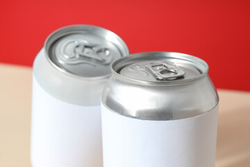 Tin cans for drinks on a light background