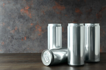 Tin cans for drinks on a dark background