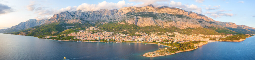 Aerial view of the town of Makarska, Dalmatia, Croatia. Summer landscape with yachts, sea, architecture and rocks, famous tourist destination at Adriatic seacoast, travel background, large panorama - 781162018