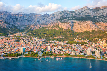 Beautiful aerial view of the town of Makarska, Dalmatia, Croatia. Summer landscape with yachts, sea, architecture and rocks, famous tourist destination at Adriatic seacoast, travel background - 781162077