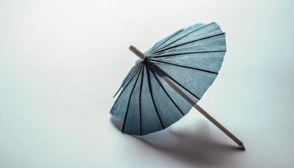 cocktail umbrella isolated on a white background blue paper cocktail or drink umbrella isolated on a white background
