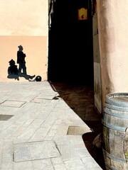 Vertical shot of a tromploy, a trick in painting, of people in Toulon city center, France