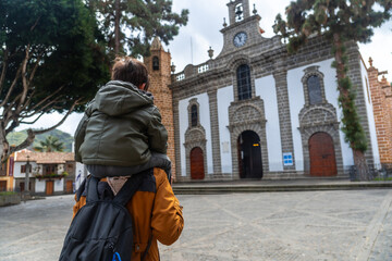 A mother with her son visiting the Basilica of Nuestra Senora del Pino in the municipality of...